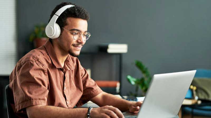 Youth sitting at Laptop